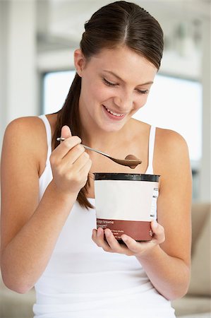 Young Woman Eating Chocolate Ice-Cream Stock Photo - Budget Royalty-Free & Subscription, Code: 400-04888401