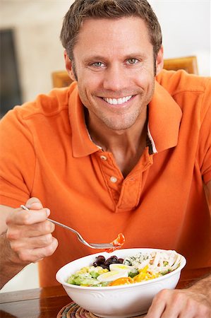 simsearch:400-04044761,k - Middle Aged Man Eating A Healthy Meal, Smiling At The Camera Foto de stock - Super Valor sin royalties y Suscripción, Código: 400-04888542