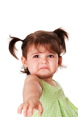 Cute baby toddler young little girl with very sad face expression reaching out for help, isolated. Stock Photo - Budget Royalty-Free & Subscription, Code: 400-04889359