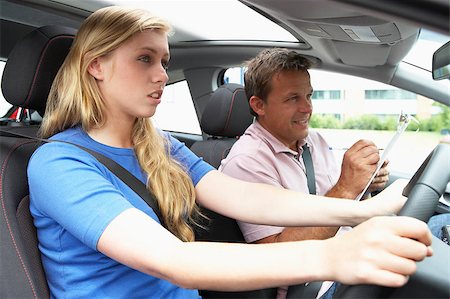 simsearch:400-04889661,k - Teenage Girl Taking A Driving Lesson Foto de stock - Royalty-Free Super Valor e Assinatura, Número: 400-04889644