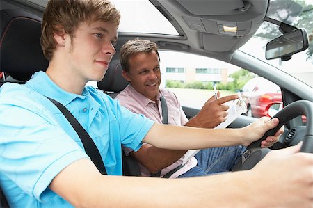 simsearch:400-04889661,k - Teenage Boy Taking A Driving Lesson Foto de stock - Royalty-Free Super Valor e Assinatura, Número: 400-04889646