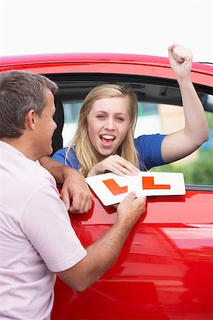Teenage Girl Receiving Her Learner Plates Stock Photo - Budget Royalty-Free & Subscription, Code: 400-04889657