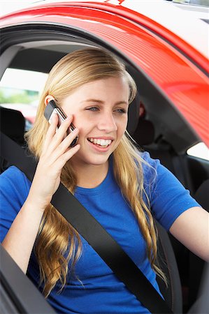 Teenage Girl Sitting In Car Talking On Cellphone Stock Photo - Budget Royalty-Free & Subscription, Code: 400-04889658