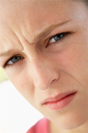 simsearch:400-04889881,k - Portrait Of Teenage Girl Frowning Stock Photo - Budget Royalty-Free & Subscription, Code: 400-04889875