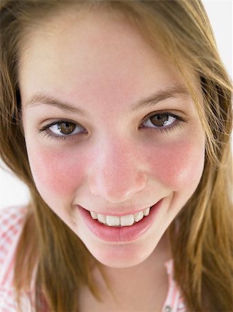 Portrait Of Teenage Girl Smiling Stock Photo - Budget Royalty-Free & Subscription, Code: 400-04889887