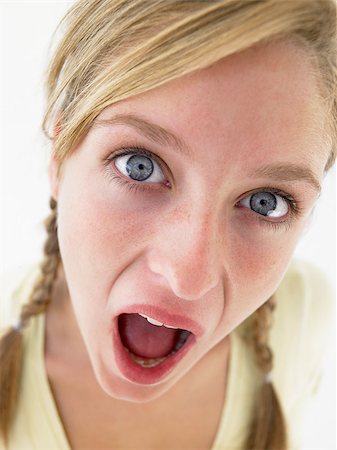 Portrait Of Teenage Girl Looking Shocked Stock Photo - Budget Royalty-Free & Subscription, Code: 400-04889881