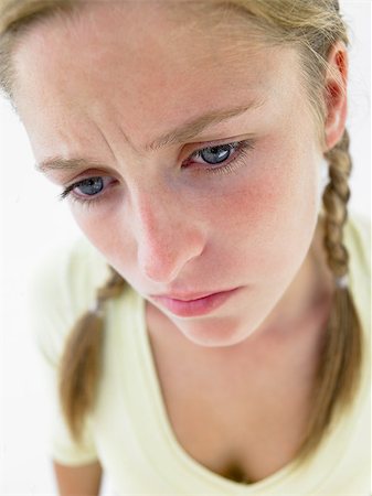 simsearch:400-04890006,k - Portrait Of Teenage Girl Frowning Stock Photo - Budget Royalty-Free & Subscription, Code: 400-04889882