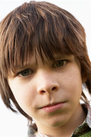 simsearch:400-04889985,k - Portrait Of Boy Frowning Photographie de stock - Aubaine LD & Abonnement, Code: 400-04889916