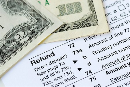 rimborso - Money refunded on the United States tax return Fotografie stock - Microstock e Abbonamento, Codice: 400-04880065