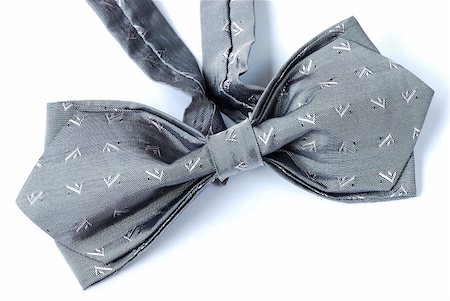 A gray bow tie isolated on white Stock Photo - Budget Royalty-Free & Subscription, Code: 400-04880352