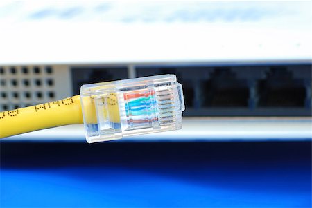 simsearch:700-00094591,k - Plug the Ethernet network cable to the router or bridge isolated on blue Stock Photo - Budget Royalty-Free & Subscription, Code: 400-04880368