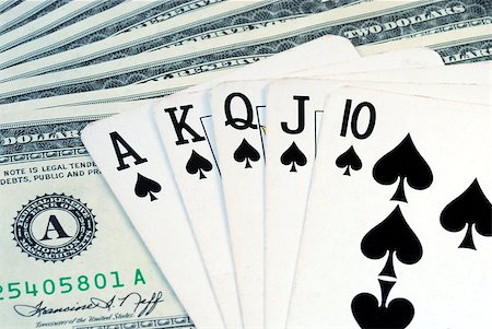 simsearch:400-04651363,k - The Royal Flush on the top of some dollar bills Photographie de stock - Aubaine LD & Abonnement, Code: 400-04880389