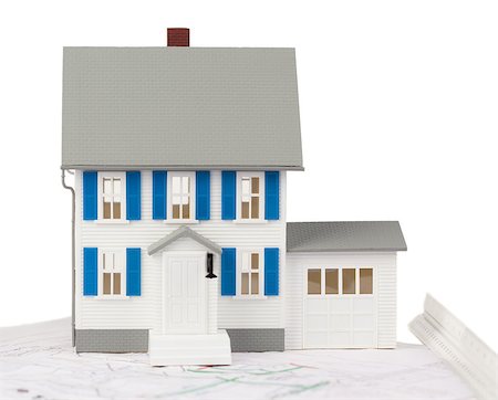 preliminary - Front view of a toy house model on a ground floor plan against a white background Stock Photo - Budget Royalty-Free & Subscription, Code: 400-04881164
