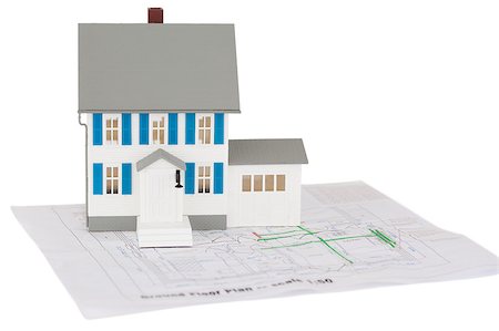 diagrammatic drawing in architecture - Closeup of a toy house model on a ground floor plan against a white background Stock Photo - Budget Royalty-Free & Subscription, Code: 400-04881161