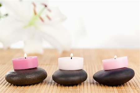 simsearch:400-04881211,k - Lighted candles on black pebbles Stock Photo - Budget Royalty-Free & Subscription, Code: 400-04881207