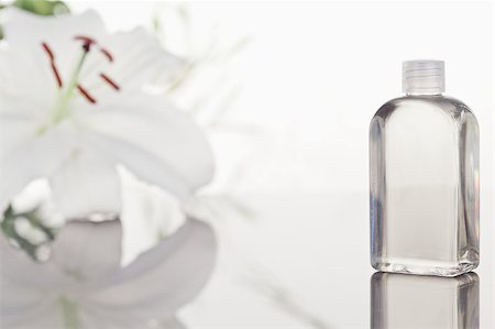 simsearch:400-04881211,k - White orchid a glass phial with a camera focus on the object Stock Photo - Budget Royalty-Free & Subscription, Code: 400-04881208