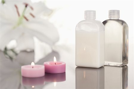 White orchid  glass phials and lighted pink candles Stock Photo - Budget Royalty-Free & Subscription, Code: 400-04881211