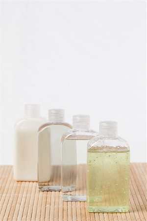 simsearch:400-06479158,k - Four massage oil bottles Stock Photo - Budget Royalty-Free & Subscription, Code: 400-04881292