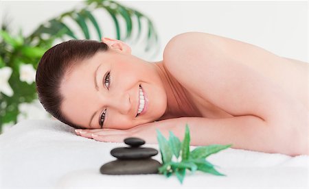 simsearch:400-04881818,k - Happy young woman lying on her belly in a spa Fotografie stock - Microstock e Abbonamento, Codice: 400-04881726