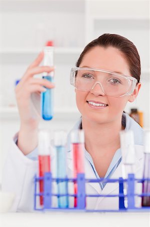 simsearch:400-04881576,k - Portrait of a cute scientist storing a test tube Stock Photo - Budget Royalty-Free & Subscription, Code: 400-04881775