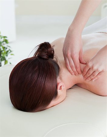 Portrait of a red-haired woman having a rolling massage Stock Photo - Budget Royalty-Free & Subscription, Code: 400-04881873