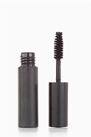 simsearch:400-08042102,k - A black tube and brush of mascara against a whhite background Stock Photo - Budget Royalty-Free & Subscription, Code: 400-04882276