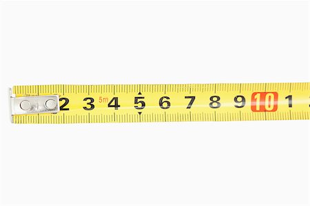 simsearch:400-07919463,k - Close up of a yellow measuring tape against a white background Stock Photo - Budget Royalty-Free & Subscription, Code: 400-04882299