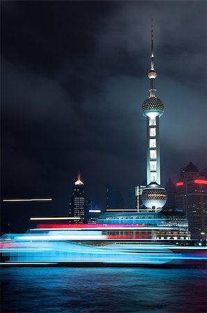 Motion of boat moving on the river with Oriental pearl tower background Great night scene at the Bund Shanghai, China Photographie de stock - Aubaine LD & Abonnement, Code: 400-04882529