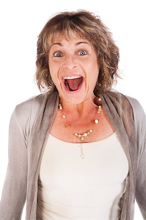 Portrait of amazed attractive senior woman over white background Stock Photo - Budget Royalty-Free & Subscription, Code: 400-04882576