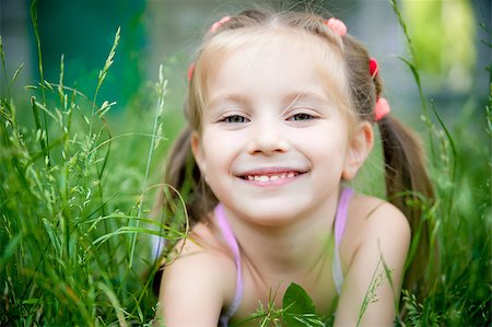 simsearch:400-05342069,k - cute little girl smiling in a park close-up Stock Photo - Budget Royalty-Free & Subscription, Code: 400-04882696