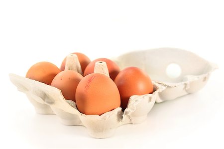 six eggs in an egg carton on a white background Stock Photo - Budget Royalty-Free & Subscription, Code: 400-04882742