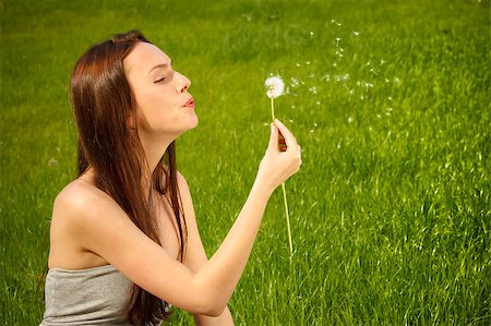 Girl with dandelion on green field Stock Photo - Budget Royalty-Free & Subscription, Code: 400-04882798