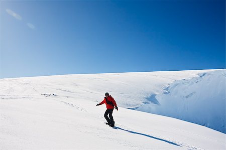 Man moves on snowboard. Glacier in background. Antarctica Stock Photo - Budget Royalty-Free & Subscription, Code: 400-04882831