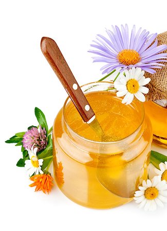 sweet honey in glass jars with spoon and flowers isolated on white background Stock Photo - Budget Royalty-Free & Subscription, Code: 400-04883471