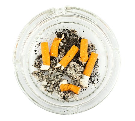 simsearch:695-05770887,k - Top view of a glass ashtray with stubbed out cigarette butts Photographie de stock - Aubaine LD & Abonnement, Code: 400-04883797