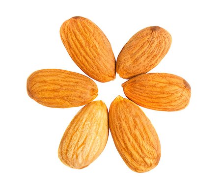 Six almond nuts out on a circle isolated on white background. Top view Stock Photo - Budget Royalty-Free & Subscription, Code: 400-04883798