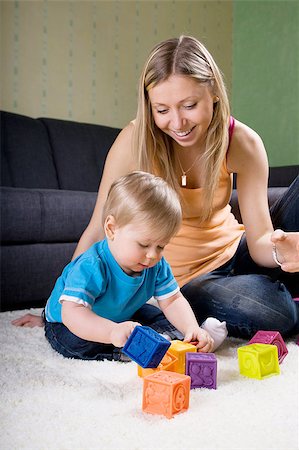 simsearch:400-04467628,k - Young mother playing with baby boy ( 1 year old ) at home. Photographie de stock - Aubaine LD & Abonnement, Code: 400-04895045