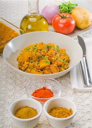 fresh home made curry beef rice and potatoes with ingredients around composition Stock Photo - Budget Royalty-Free & Subscription, Code: 400-04895431