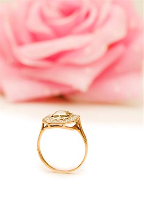 simsearch:400-05244104,k - Golden ring and rose at the background Stock Photo - Budget Royalty-Free & Subscription, Code: 400-04895632