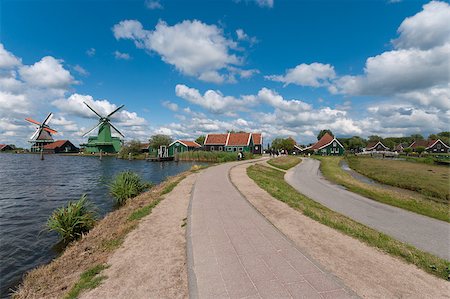 road along the water with the famous windmills of the zaanse schans Stock Photo - Budget Royalty-Free & Subscription, Code: 400-04895818