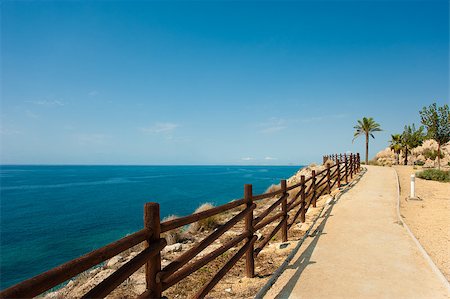 Scenic footpath winding atop a cliff above the Mediterranean Stock Photo - Budget Royalty-Free & Subscription, Code: 400-04895950