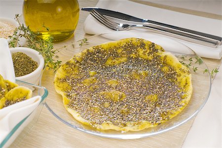 sommaco - lebanese manouche or manoushe ,lebanese pizza with thyme and sesame seeds,zaatar, and extra virgin olive oil on top Fotografie stock - Microstock e Abbonamento, Codice: 400-04896469