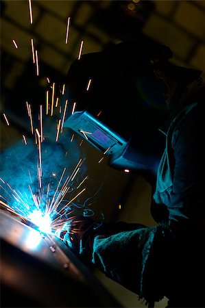 Close-up photo of welding process with sparks flying around Stock Photo - Budget Royalty-Free & Subscription, Code: 400-04896668