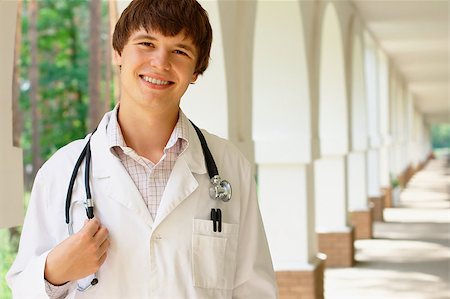 doctor and teenage boy - Portrait of a young smiling doctor with copy space Stock Photo - Budget Royalty-Free & Subscription, Code: 400-04896662