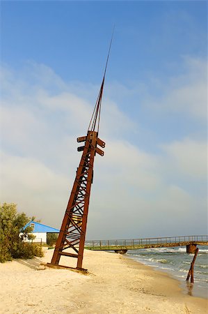 Old rusty metal tilted tower with lightning rod on the seashore. Kinburn Spit near Ochakiv, Ukraine Stock Photo - Budget Royalty-Free & Subscription, Code: 400-04897172