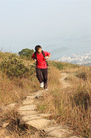 simsearch:400-04126574,k - Sport hiking in mountains, walking and backpacking , the man in motion blur Fotografie stock - Microstock e Abbonamento, Codice: 400-04897398