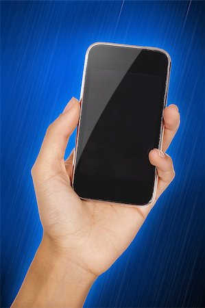 Woman's hand with a glossy 3D mobile phone, close-up shot Stock Photo - Budget Royalty-Free & Subscription, Code: 400-04897737