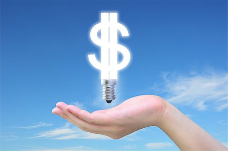 simsearch:400-04900554,k - light bulb model of a dollar symbol in women hand on sky Photographie de stock - Aubaine LD & Abonnement, Code: 400-04897760