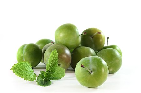 silencefoto (artist) - fresh green plums on a white background Stockbilder - Microstock & Abonnement, Bildnummer: 400-04897921