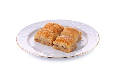 Turkish traditional dessert Baklava served in porcelain dish isolated on white with clipping path Fotografie stock - Microstock e Abbonamento, Codice: 400-04898030